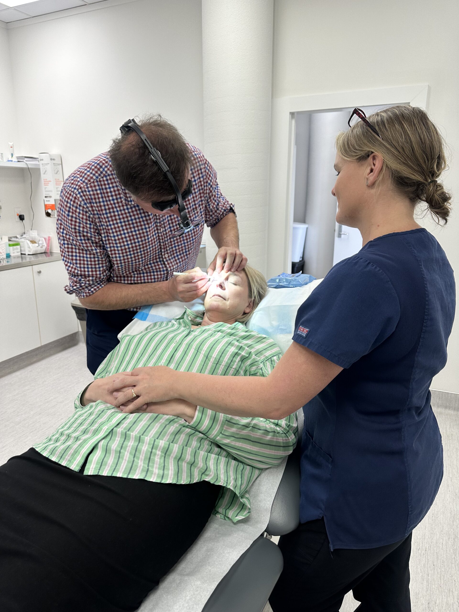 Patient having eyelid surgery (blepharoplasty) under local anaesthetic at Waikato Specialist Centre